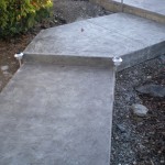 Charcoal Colored Stamped Concrete Sidewalk Calgary 